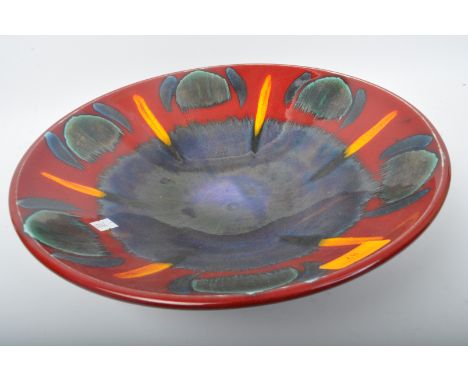 Poole Pottery - Modern English design. A Poole pottery centre piece fruit bowl. Having a blue and red ground geometric repeat
