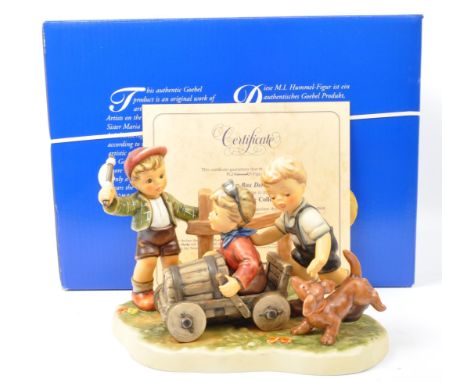 Hummel Goebel - A NOS New Old Stock Hummel Goebel German bone china group figurine. The figure entitled Soap Box Derby, the f