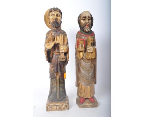 Two 20th century Russian orthodox carved wood hand painted figures to depict St Peter holding keys to heaven and hell. Measur