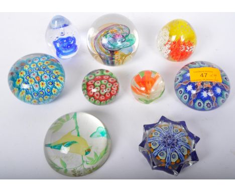 An assortment of vintage 20th century glass paperweights to include Venetian Murano Millefiori paperweights, bubble control e