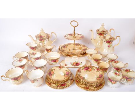 A vintage 20th Century Royal Albert - Old Country Roses tea service set. Comprising of cups, saucers, cake tier stand, milk j