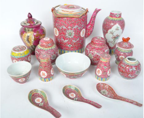 An assortment of vintage 20th century ceramic Chinese Oriental Famille Rose items. The lot to include a bamboo handled teapot