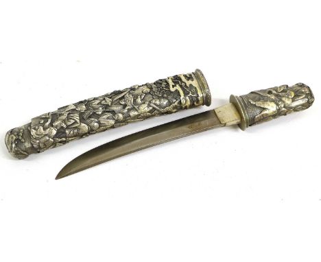 A Copy of a Japanese Tanto Dagger, the hilt and scabbard of silvered resin moulded with figures amid fir trees.