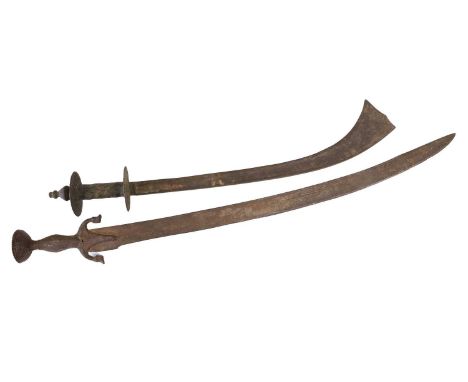 A 19th Century Indian Kora, the 53cm single edge curved steel blade with fish-tail tip, the hilt with disc guard and pommel, 