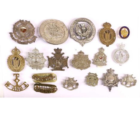 A Collection of Eighteen Military Badges, comprising a Victorian Border Regiment bandsmans sheet music holder, a Border Regim