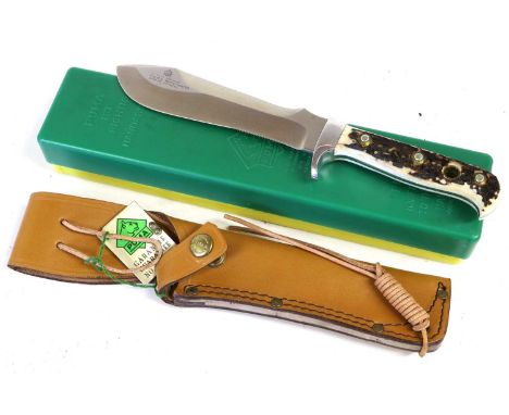 A Puma White Hunter Knife, the 15.5cm steel blade numbered 11 6375, and with reinforced tip, with aluminium crossguard and st