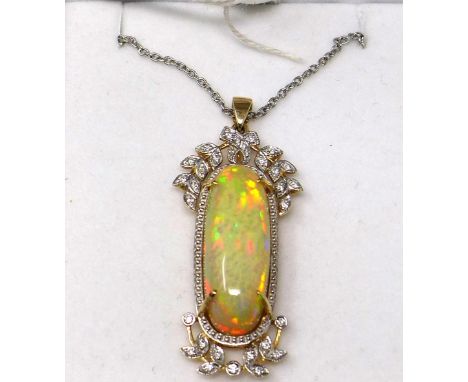 A 14ct yellow and white gold, large natural, oval opal and diamond set pendant on an 18ct white gold chain, L: 58cm, Pendant:
