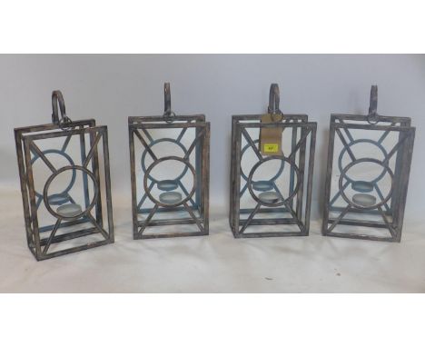 A set of 4 tea light candle holders 