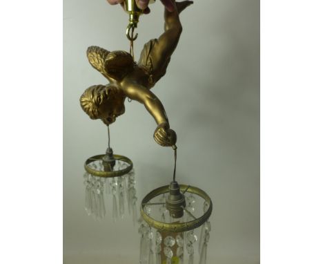 A 20th century gilt plaster ceiling light in the form of a cherub 