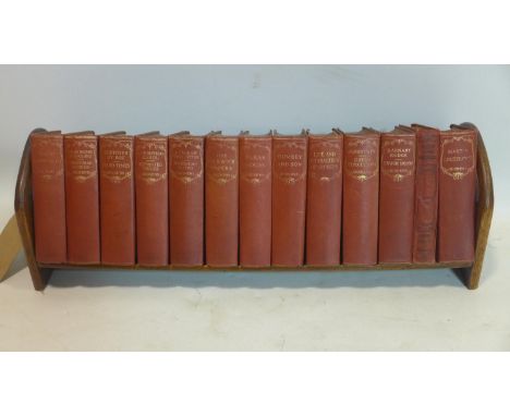 An oak book trough, with the complete works of Charles Dickens 