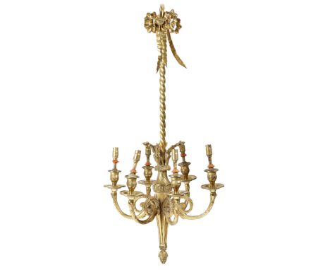 A late 19th century French ormolu six-light chandelier in Louis XVI style, decorated with ribbons and leaves, with a torch st