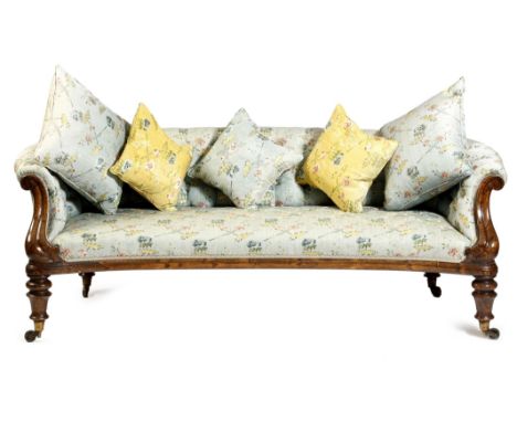 An early Victorian simulated rosewood settee by Holland & Sons, with a concave front and button upholstered with blue floral 