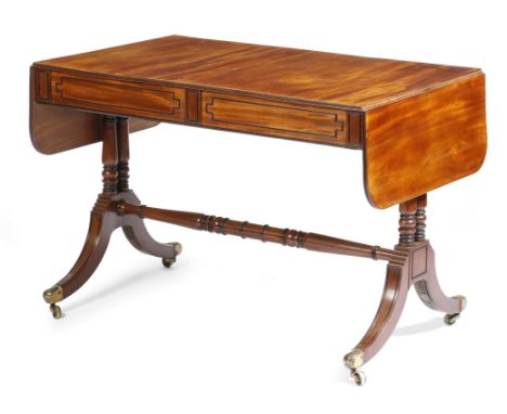 A late Regency mahogany sofa table, with ebonised outline mouldings, the drop-leaf top with a reeded edge, above a pair of ce