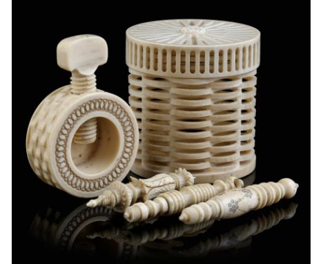 λ A 19th century ivory screw-action nutcracker, with engine turned decoration, an ivory reticulated box and cover, the base s