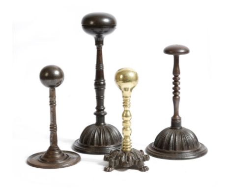An early 19th century cast iron ball iron, the hinged top with a recess for a hot coal, above a ring turned stem and a 'lemon