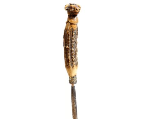 A 19th century antler handled honing steel, carved with a bull's head finial, with glass eyes, 32cm long.Click here to view t