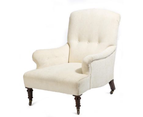 A late Victorian easy armchair, with later button upholstered ivory fabric, on turned oak front legs and ceramic castors.Clic