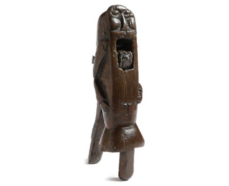 A rare 18th century primitive treen oak lever action figural nutcracker, in the form of a man with a flat face and a moustach