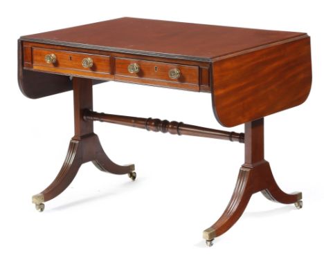 A George IV mahogany sofa table, the drop-leaf top with a reeded edge, above a pair of frieze drawers with false fronts to th