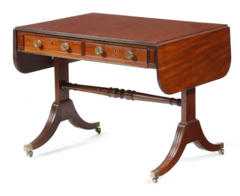 A George IV mahogany sofa table, the drop-leaf top with a reeded edge, above a pair of frieze drawers with false fronts to th