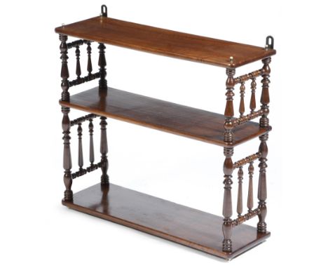 A Victorian walnut hanging wall shelf, with turned spindle ends, 63.3cm high, 70cm wide, 22cm deep.Click here to view the onl