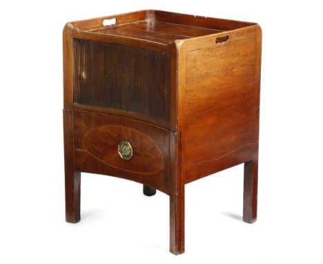 A George III mahogany tray-top bedside commode, the gallery with pierced handgrips, above a concave front, with a tambour shu