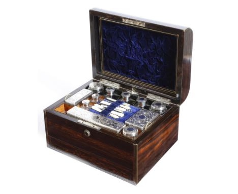 A Victorian coromandel dressing case, inlaid with brass stringing, the hinged lid with a vacant plaque, the underside of the 