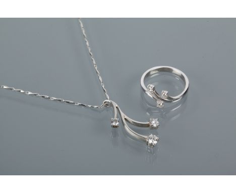 DESIGNER DIAMOND SET PENDANT AND RING
by Andrew Strang, the pendant in platinum, set with brilliant cut diamonds totalling ap