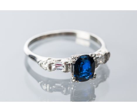 IMPRESSIVE EARLY TWENTIETH CENTURY SAPPHIRE AND DIAMOND RING
the oval cut sapphire approximately 1 carat, on baguette and bri