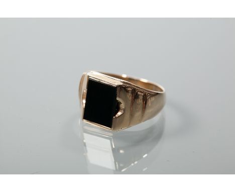 GENTLEMAN'S ONYX SET SIGNET RING
with a central rectangular onyx panel, hallmarked nine carat gold, size U