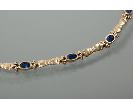 EIGHTEEN CARAT GOLD SAPPHIRE BRACELET
with six oval sapphires, marked "750" for eighteen carat gold, 190mm, 8.8gms gross
