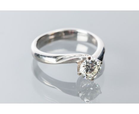 DIAMOND SOLITAIRE RING
the central brilliant cut diamond approximately 0.74 carats, marked ''750'' for eighteen carat gold, s