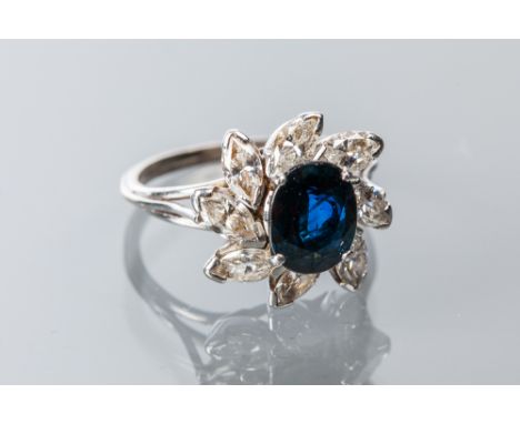 SAPPHIRE AND DIAMOND CLUSTER RING
the central oval cut sapphire of approximately 1.63 carats surrounded by marquise cut diamo