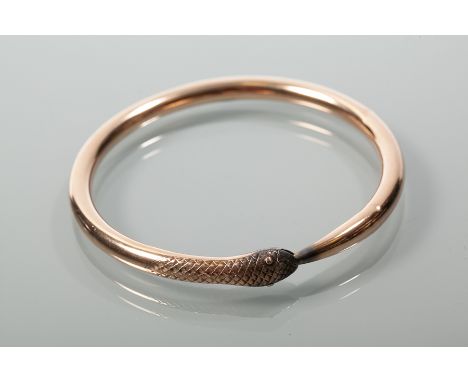 UNUSUAL NINE CARAT GOLD SERPENT MOTIF SLEEVE BANGLE
hallmarked nine carat gold, 8cm diameter, 17.4g