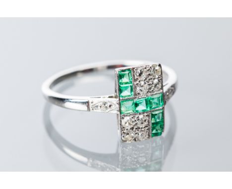 ART DECO EMERALD AND DIAMOND CLUSTER RING
the rectangular bezel set with suare cut emeralds and brilliant cut diamonds, on di