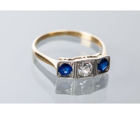 ART DECO SAPPHIRE AND DIAMOND THREE STONE RING
set with a brilliant cut diamond approximately 0.3 carats, flanked by two roun