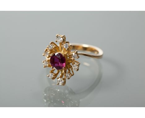 RUBY AND DIAMOND CLUSTER RING
the central brilliant cut ruby surrounded by a row of brilliant cut diamonds, unmarked, size P-