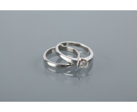 DIAMOND SOLITAIRE RING 
the brilliant cut diamond approximately 0.2 carats, in platinum, size N, along with a platinum weddin