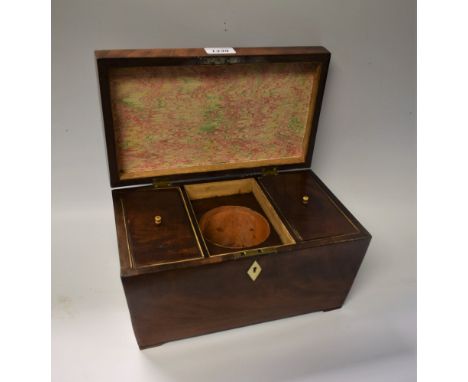 A George III sarcophagus mahogany tea caddy, two lidded compartments with vacant central mixing area, c1820