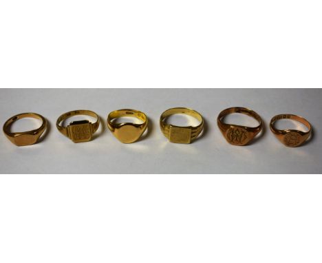 Rings - a gentleman's 9ct gold plain topped signet ring, size P;  others sizes R, S,V, W, 22.2g;  another indistinctly marked