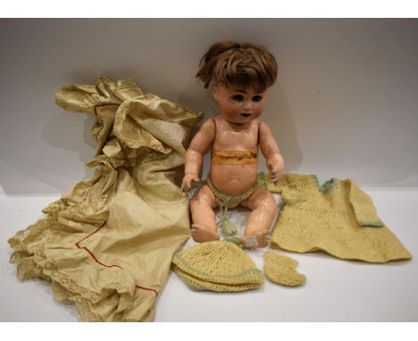 Dolls - a German Schuetzmeister and Quenot porcelain head crying baby doll, blue eyes, open mouth, light brown wig, two secti