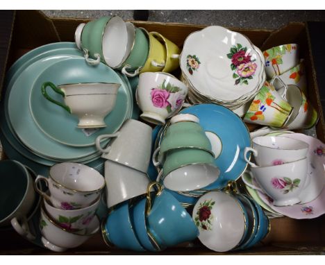 A Staffordshire floral printed part tea set; an Art Deco cup and saucer; others, Shelley, Poole