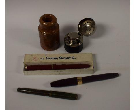 A Sheaffer maroon fountain pen, gold nib; a Conway Stewart ruby lady's pen, original box; a Parker marbled green pen; a trave