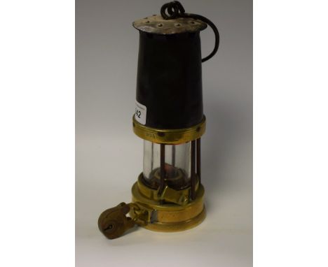 A 19th century steel and brass miner's lamp, by Davis, stamped