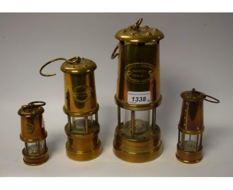 A brass miners lamp, Hockley Lamp & Limelight Company; others similar including miniature lamps (4)