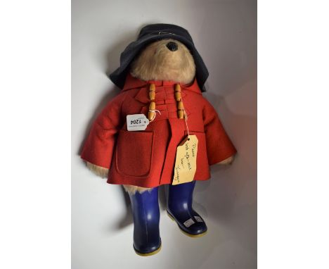 A Gabriel Designs Paddington Bear stuffed toy, red coat, blue hat and wellington boots, original label