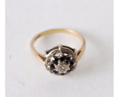 SAPPHIRE AND DIAMOND 18CT GOLD CLUSTER RING, illusion set with single cut diamond and cluster surround of eight round cut sap