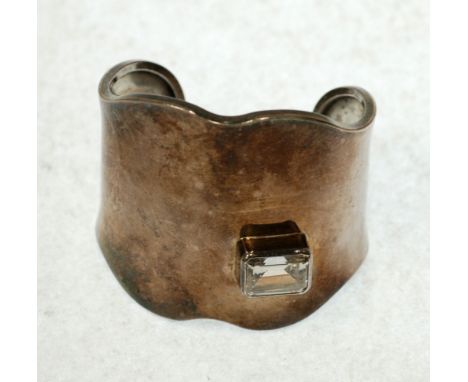 MEXICAN, TAXCO, LOS BALLESTEVOS DESIGNED STERLING SILVER CUFF BRACELET, broad and plain with ruffle edges and having a large 