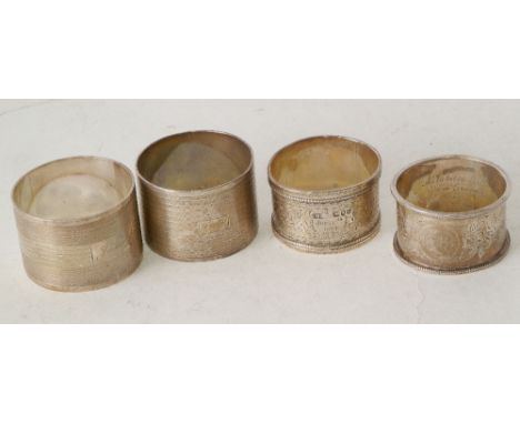 THREE VARIOUS HALLMARKED SILVER NAPKIN RINGS, AND A SILVER NAPKIN RING, marked sterling silver, 4.30oz gross (4)