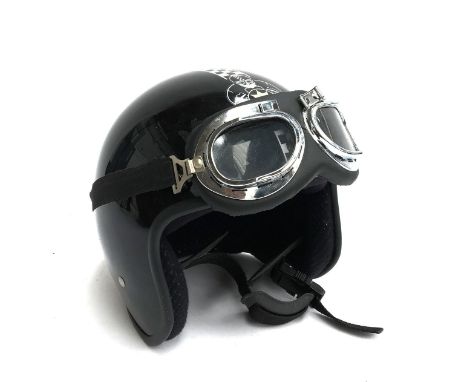 A retro 'BSA' style motorcycle helmet with goggles